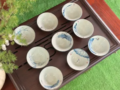 CONICAL PORCELAIN CUP, ASH GLAZE WITH HAND-PAINTED MOTIF - CAPACITY 85ML