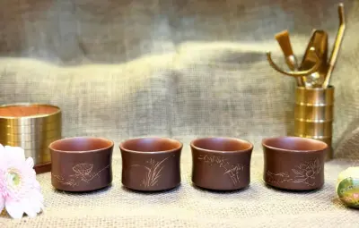 QINZHOU NIXING TEACUP WITH CARVED NATURE MOTIF — HANDMADE — 60 ML CAPACITY